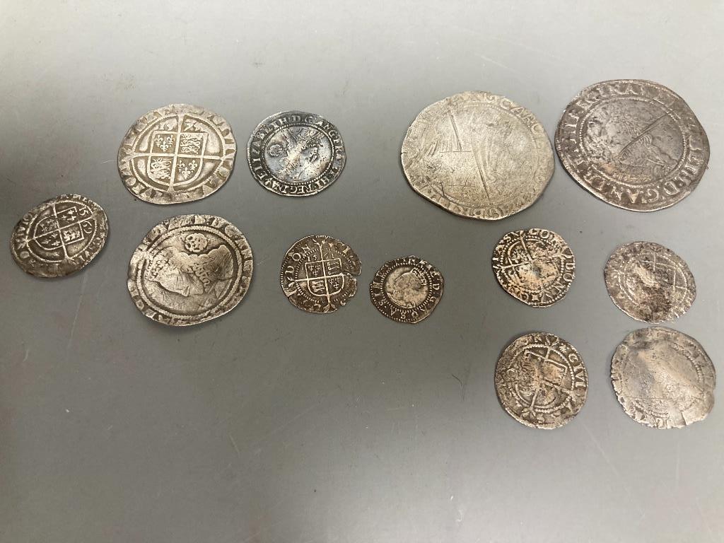 A group of Elizabeth I silver coins - two shillings, 1584 and 1575 sixpences, 1561 and 1569 threepences, 1561 halfgroat and four others worn